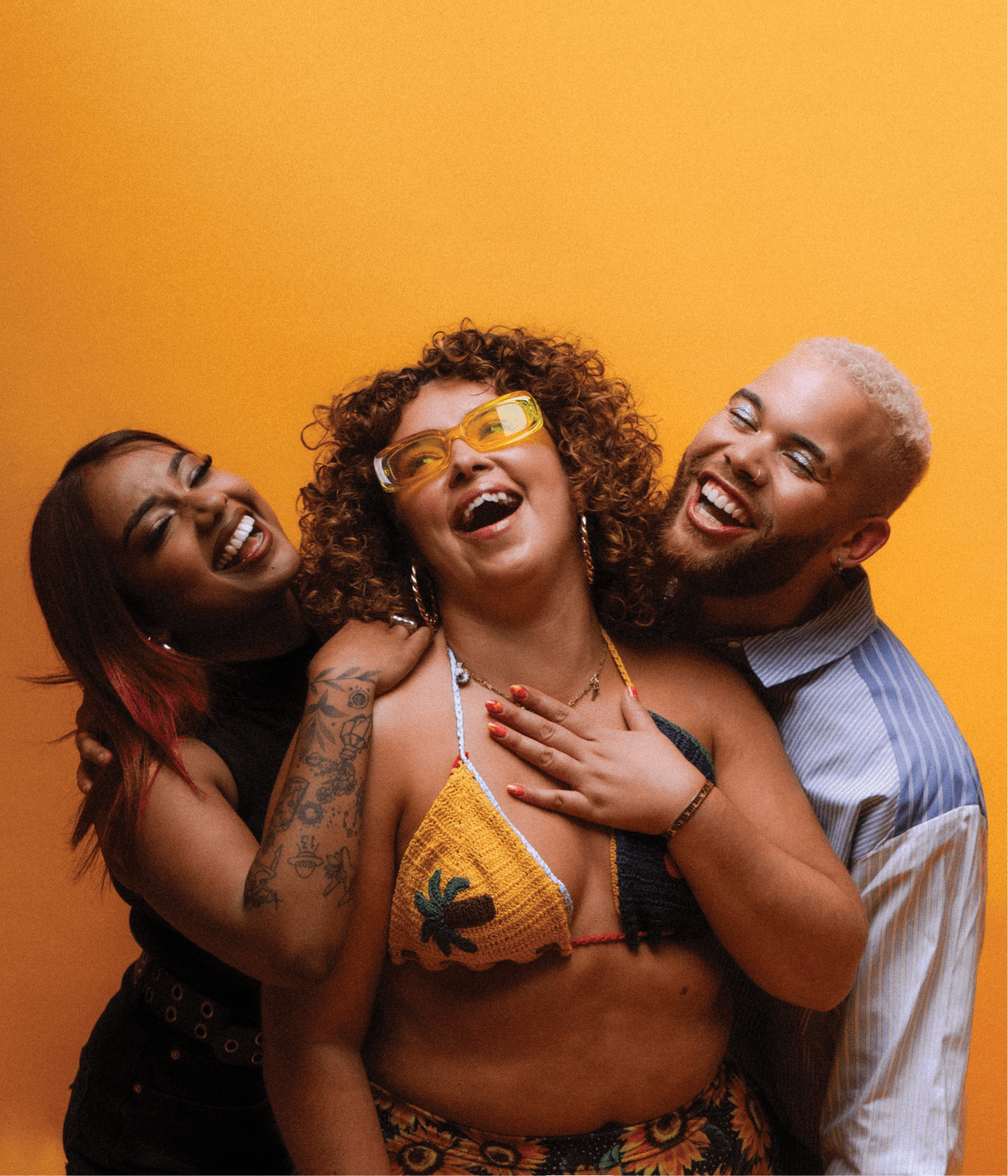 Group of diverse young people laughing and celebrating